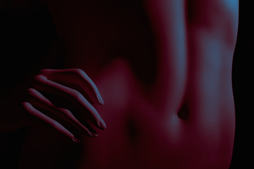 Artistic Nude Photography of Female Torso with Neon Lighting
