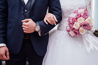 Wedding Couple Holding Hands with Pink Rose Bouquet