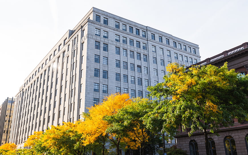 Modern Office Building with Autumn Trees in Downtown City