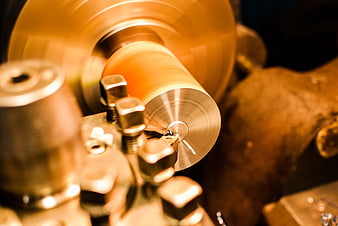 Close-up of metal lathe machining steel part