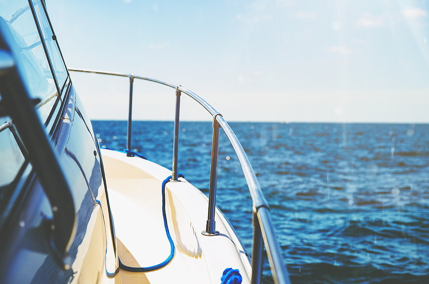 Side view of a luxury yacht sailing on the blue ocean