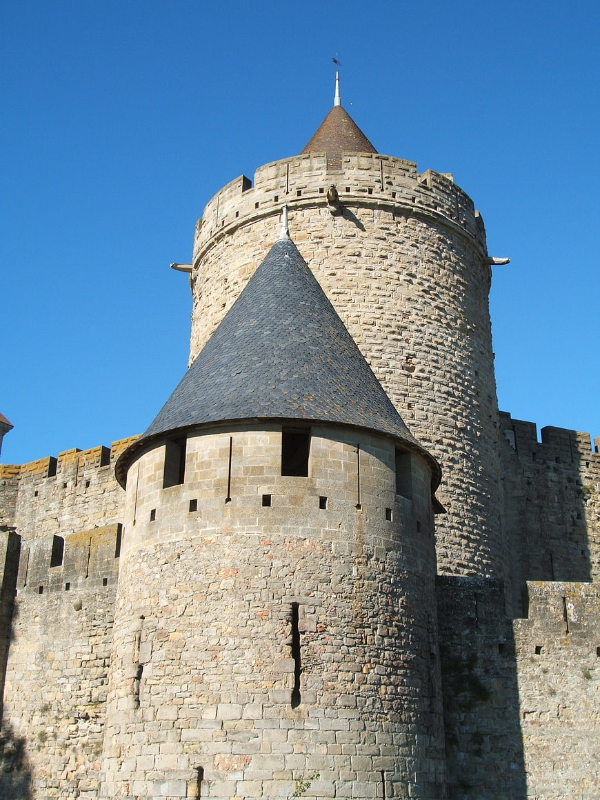 Medieval stone castle towers against blue sky