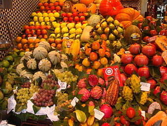 Colorful autumn fruit display at a market stall