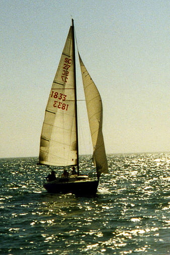 Vintage Sailboat Sailing on Sparkling Ocean Water