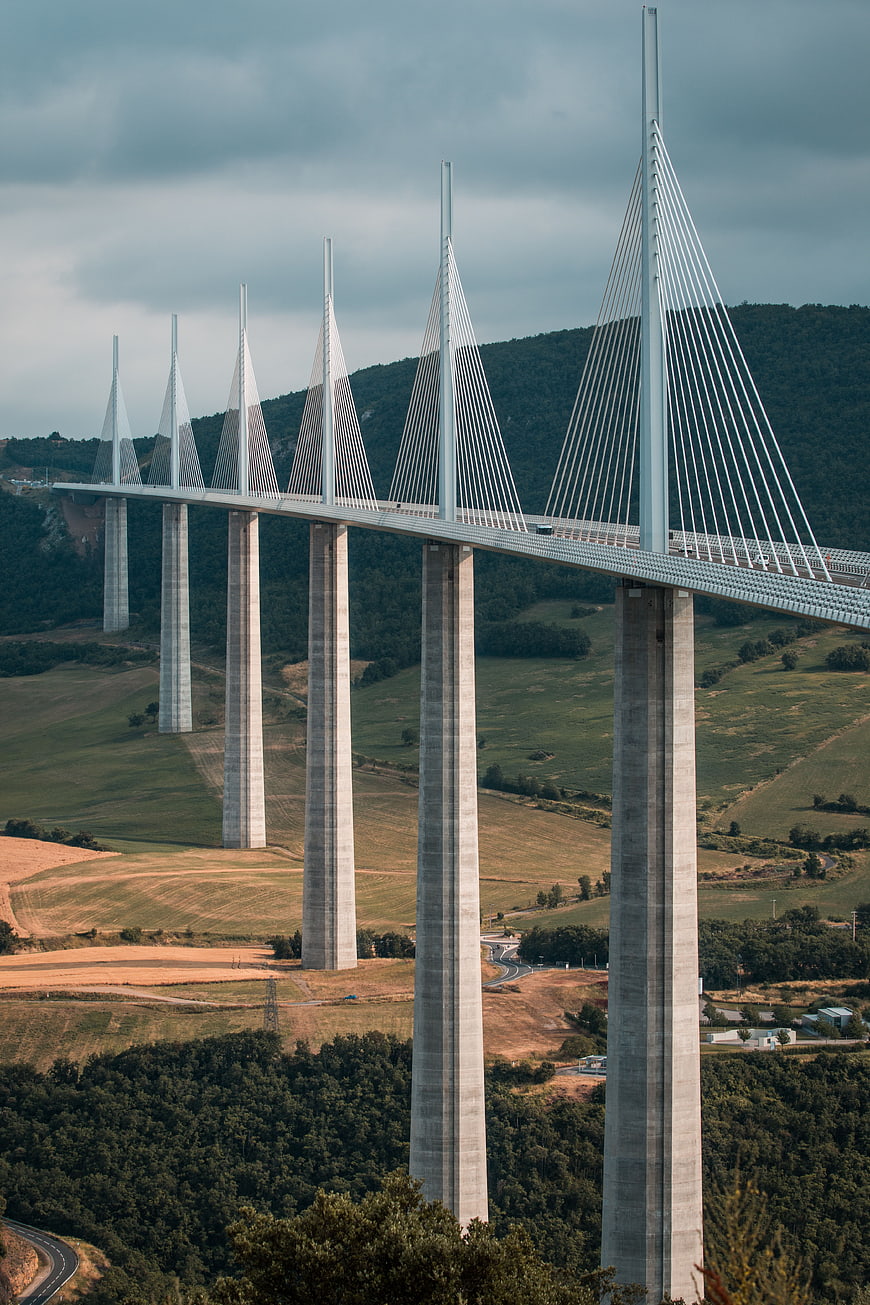 Millau Viaduct cable-stayed bridge over green valley