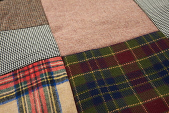 Close-up of various plaid and patterned textile fabrics