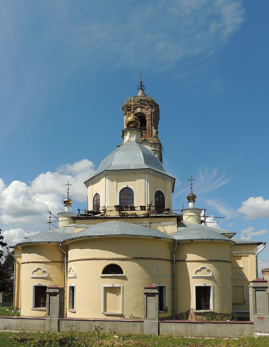 Yellow Orthodox Church Under Renovation Against Blue Sky