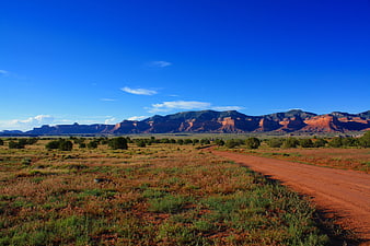 Red dirt road leading to Monument Valley mesas