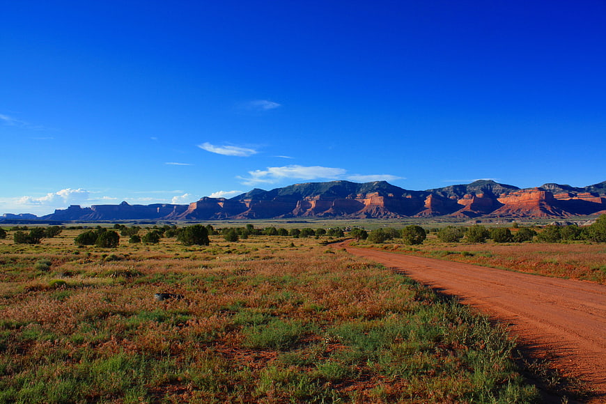 Red dirt road leading to Monument Valley mesas