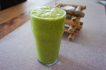 Fresh Green Smoothie in Glass on Table
