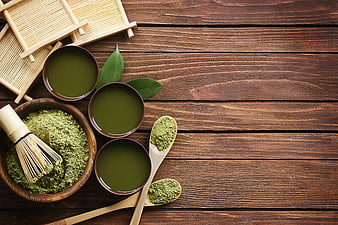Matcha Tea Set with Whisk and Powder on Wooden Table