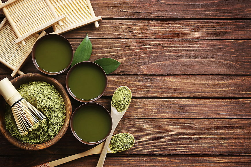 Matcha Tea Set with Whisk and Powder on Wooden Table