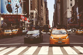 Busy New York City Street with Yellow Taxis and Traffic