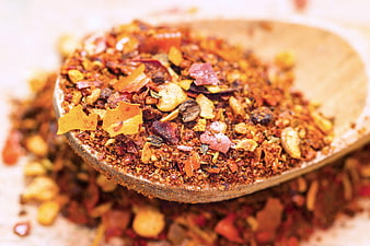 Close-up of mixed dried spices in a wooden spoon