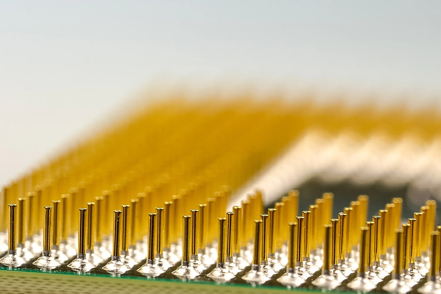 Macro view of gold processor pins on circuit board