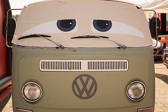 Vintage Volkswagen Bus with Cartoon Eyes and Sad Expression