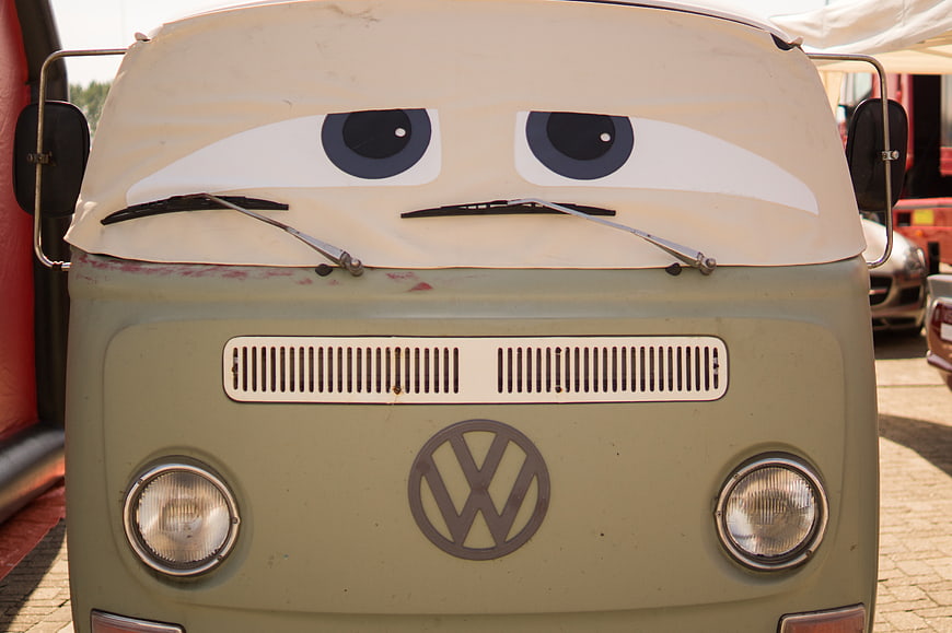 Vintage Volkswagen Bus with Cartoon Eyes and Sad Expression
