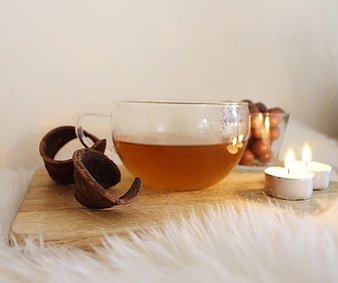 Cozy Tea Break with Candles and Hazelnuts