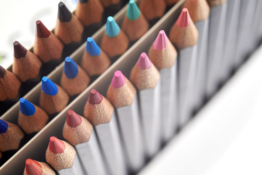 Close-up of colorful wooden pencils in a box