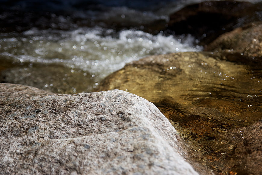 Close-up of Stream Rocks with Blurred Water Background