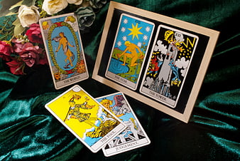 Rider-Waite Tarot Cards Arranged on Green Velvet with Flowers