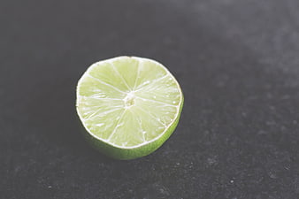 Fresh Cut Lime Half on Dark Slate Background