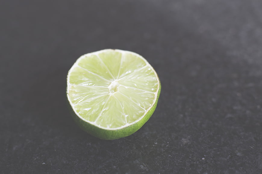 Fresh Cut Lime Half on Dark Slate Background