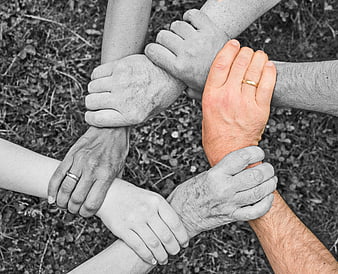 Selective Color Hands Circle Symbolizing Unity and Teamwork