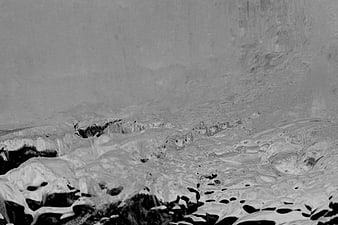 Abstract black and white texture of melting snow and ice