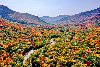 Aerial View of Vibrant Autumn Mountain Valley with River