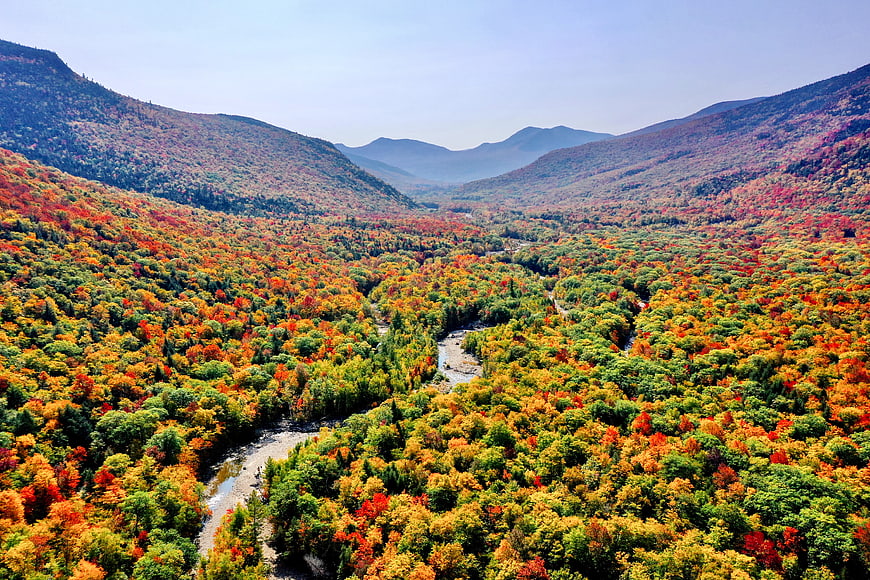 Aerial View of Vibrant Autumn Mountain Valley with River