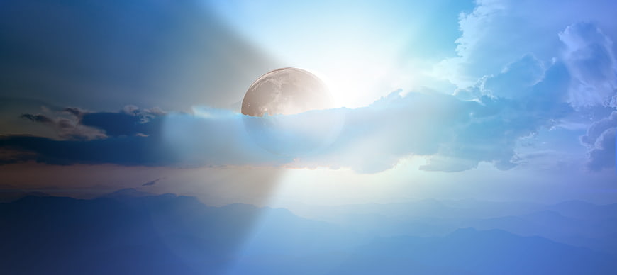 Dramatic Solar Eclipse Over Blue Mountain Landscape