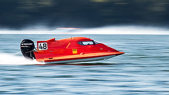 Red Racing Powerboat Speeding on Water