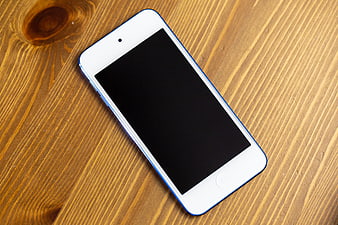 White Smartphone Mockup on Wooden Table Surface