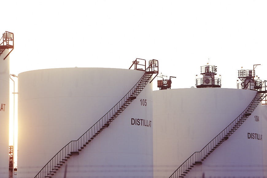 White Industrial Distillate Storage Tanks With Staircases