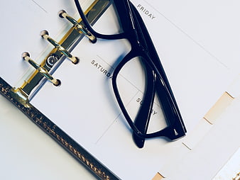 Black Glasses on Weekly Planner Calendar