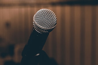 Close-up of silver microphone grille on stand