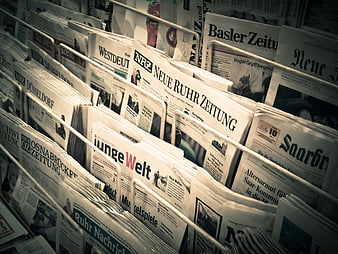 German newspapers in a metal rack display