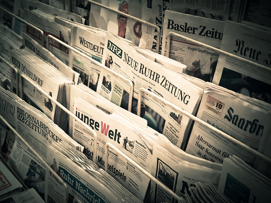 German newspapers in a metal rack display