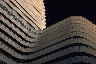 Modern Wavy Architecture Building at Night