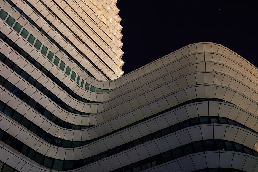 Modern Wavy Architecture Building at Night