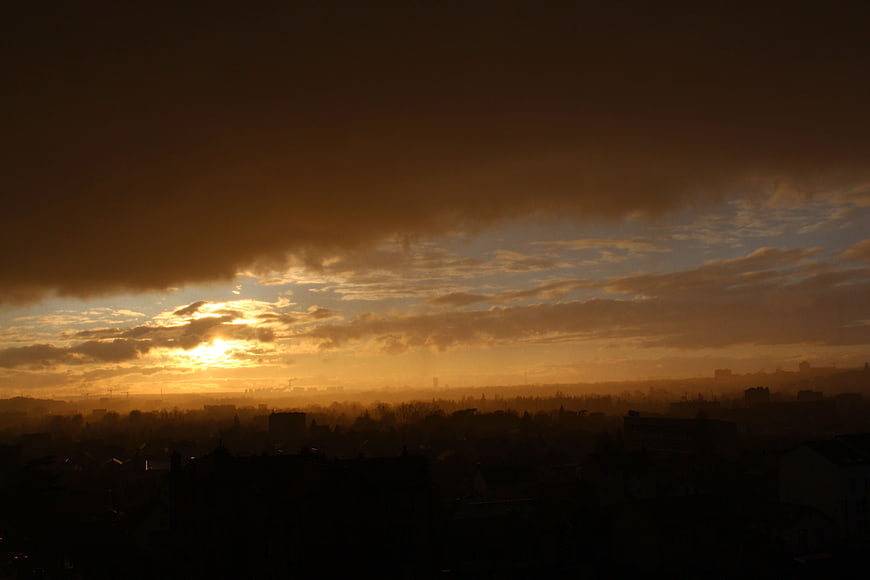 Dramatic sunset over Paris cityscape silhouette