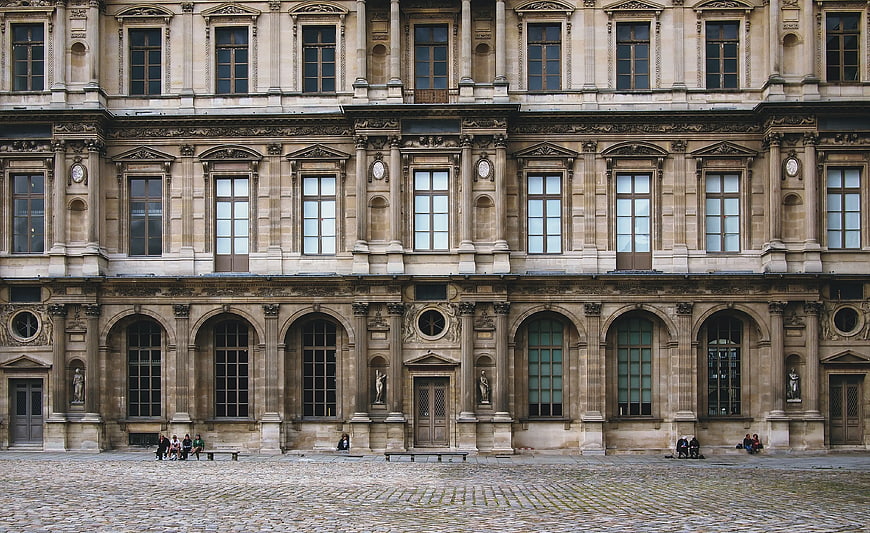 Grand Renaissance Palace Facade with Cobblestone Courtyard