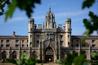 Gothic Revival University College Architecture Framed By Green Foliage
