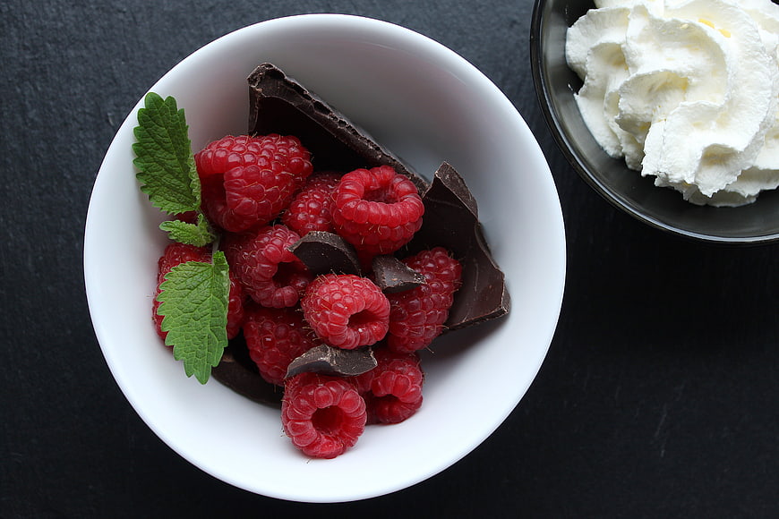 Fresh Raspberries and Dark Chocolate in White Bowl
