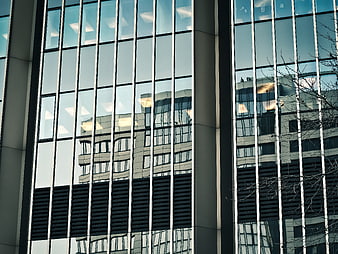 Modern Glass Skyscraper Facade with Reflections