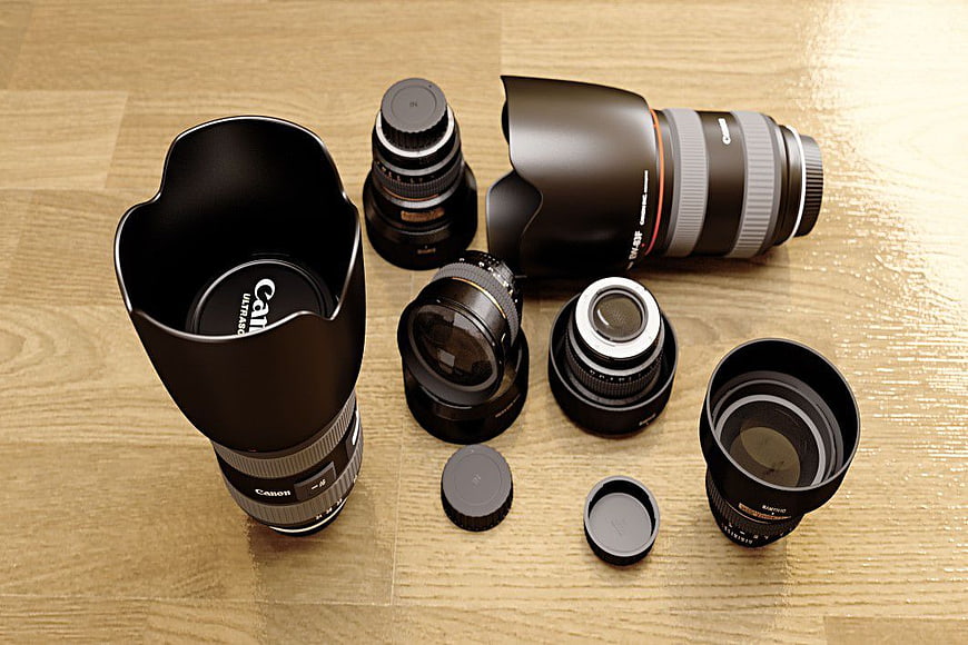 Collection of Canon Camera Lenses on Wooden Table