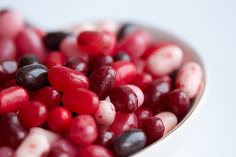 Close-up of assorted jelly beans in a white bowl