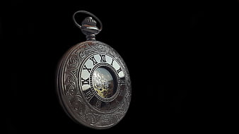 Vintage Silver Pocket Watch with Roman Numerals on Black Background