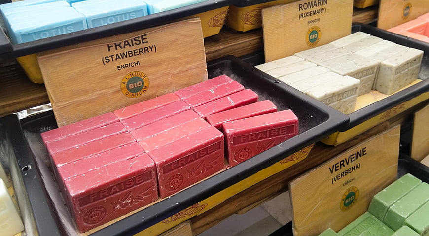 Colorful organic soap bars displayed in a market stall